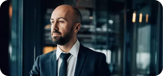 man-in-suit-looking-through-the-window